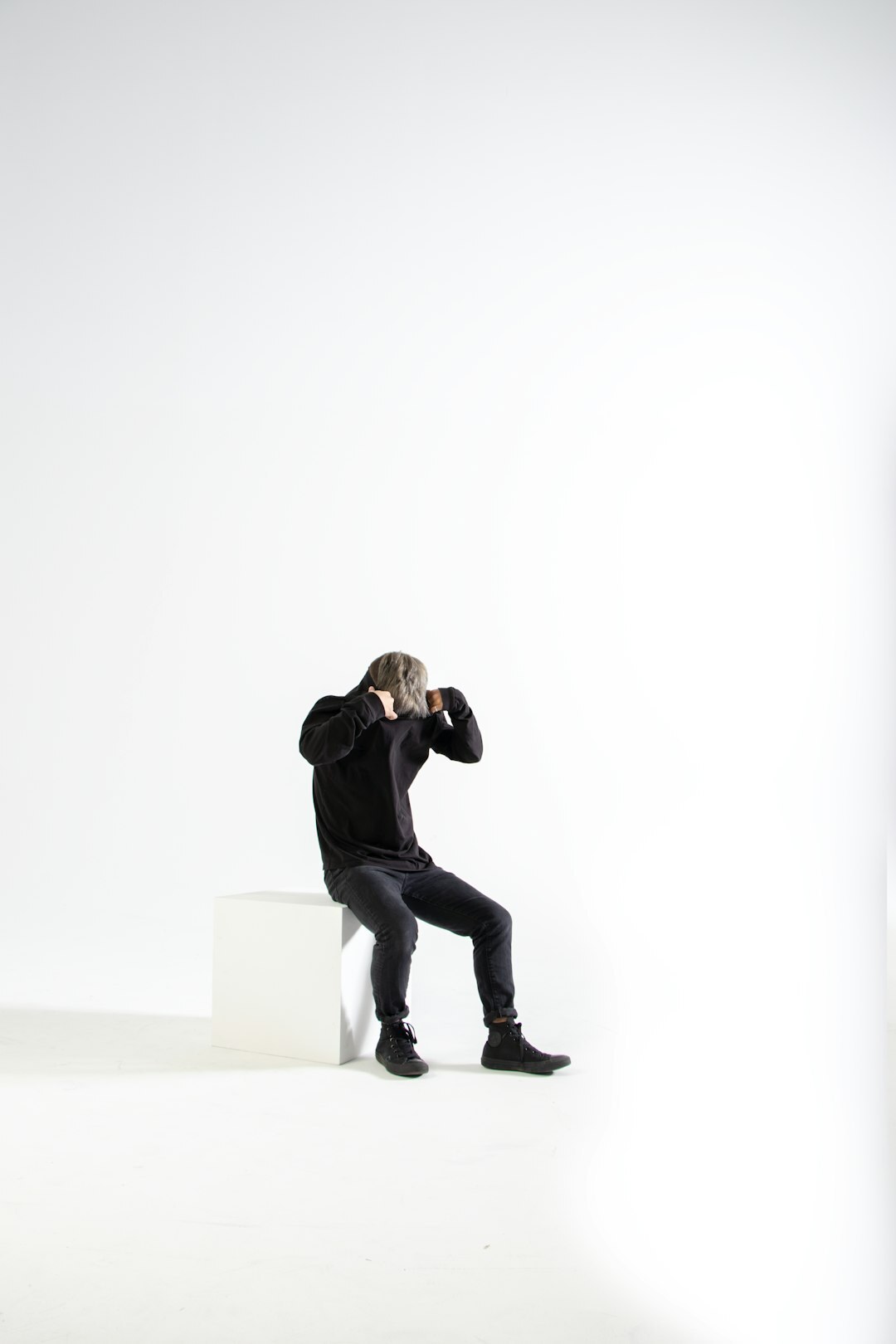 Photographer capturing a celebrity portrait session in a studio